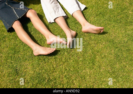 Children lying on the grass Stock Photo