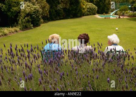 Rear view of senior women sat in a garden Stock Photo