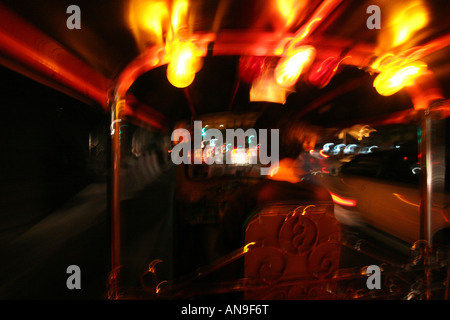 Night-time tuk tuk ride through Bangkok, Thailand Stock Photo