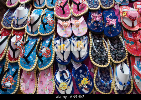 Shoes for sale on a market in Bangkok Thailand Stock Photo