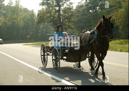 amish people travelling by horse and cart in maryland usa Stock Photo