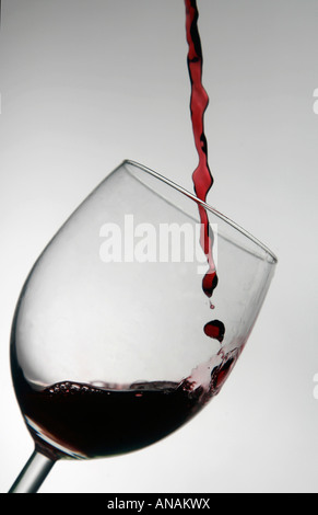 A glass of French red Beaujolais wine is poured Stock Photo