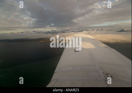 Early morning view of mountains and cloud from a light aircraft nr Haines Alaska USA Stock Photo