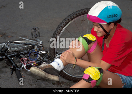 New Jersey,NJ,Mid Atlantic,The Garden State,Plainfield,Asian teen,teenager,teenagers,student students bicycle,bicycling,riding,biking,rider,bike accid Stock Photo