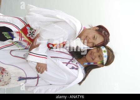 Model released inuit teens throat singing wearing their traditional clothing MR Pond Inlet Baffin Island High Arctic Canada isol Stock Photo