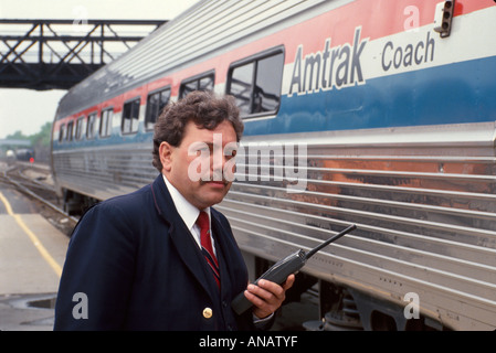New York City,NY NYC,Albany,Amtrak,train,station,two 2 way radio,conductor,passenger coach,railroad,railway,working,work,servers employee employees wo Stock Photo