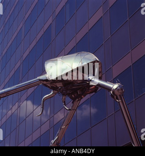 Metal sculpture of Martian from HG Wells War Of The Worlds story Statue located in Woking Surrey England building background Stock Photo