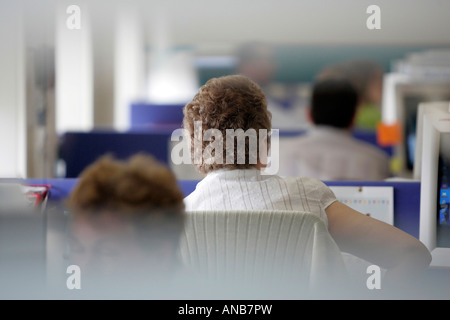 PEOPLE WORKING IN AN OFFICE ENVIRONMENT. Stock Photo