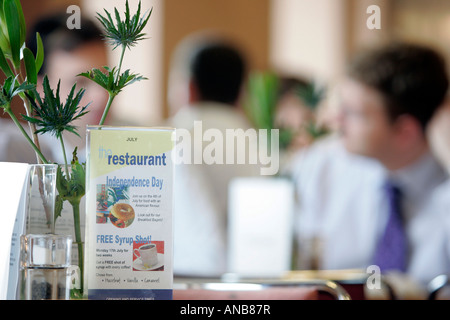 OFFICE WORKERS HAVING LUNCH IN AN OFFICE CANTEEN. Stock Photo