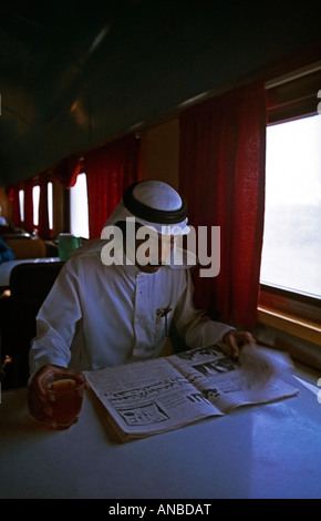 Man in dining car train Saudi Arabia Stock Photo