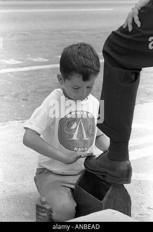 A poor shoe-shine boy in the Andean city of Merida in Venezuela Stock Photo