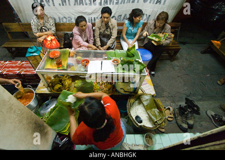 Women Enjoying Food at a Local Restaurant Solo Java Indonesia Stock Photo