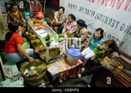 Women Enjoying Food at a Local Restaurant Solo Java Indonesia Stock Photo