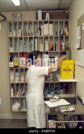 nurse disposing of needles Stock Photo
