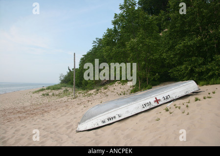 Empty sandy beach on Lake Michigan with wooden picnic table nobody no not people isolated from above overhead in USA Stock Photo