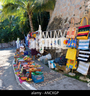 Street vendor selling handmade souvenirs on popular tourist route along the coast of Puerto Vallarta Mexico Stock Photo