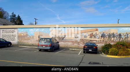 Chinese Bull Gang Outdoor Building Wall Mural in Chemainus Painted in 1984 by Ernest Marza, Victoria Stock Photo