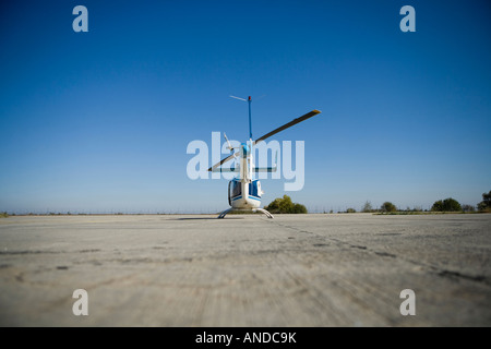 helicopter taking off from the landing track, rear view Stock Photo