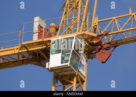 Close up detail view of tower crane cabin. Proprietary details removed. Stock Photo