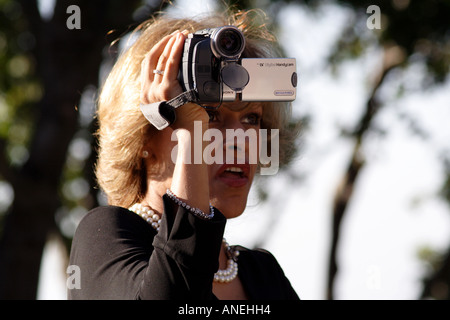 Woman Videotaping with a Digital Video Camera Stock Photo