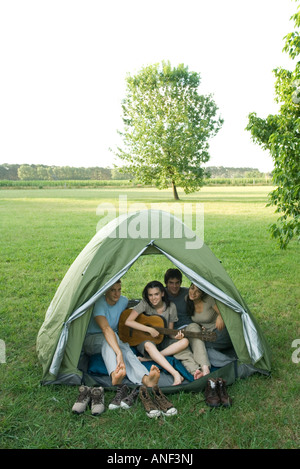 Friends in tent together Stock Photo