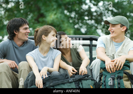 Group of young hikers in back of pick-up truck Stock Photo