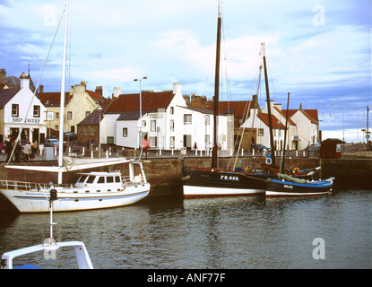 Fifie type fishing vessel Reaper tied up in Anstruther Harbour with the Scottish Fisheries Museum in the background Stock Photo