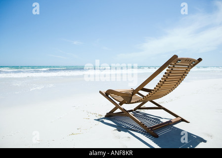 Wooden deckchair on beach Stock Photo