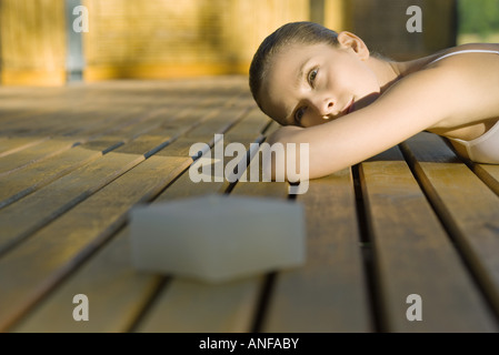Woman lying on deck Stock Photo