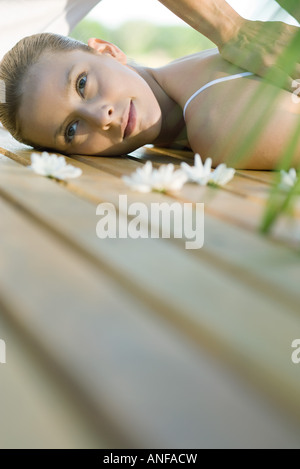 Woman lying on deck, having massage Stock Photo