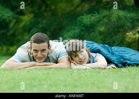 Young campers in sleeping bags Stock Photo