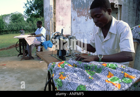 Male roadside tailors working at their sewing machines in Lugela, Mozambique Stock Photo