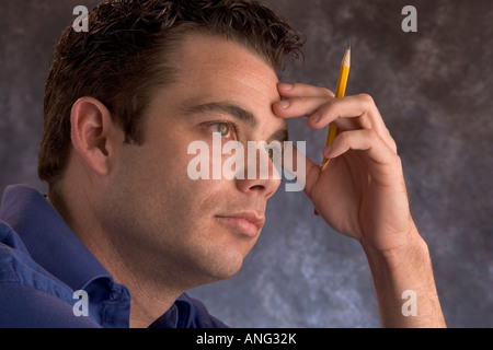 Man thinking listening to a lecture or deep in thought. Stock Photo