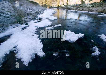 A partially frozen river in Easedale near Grasmere in the Lake District during a cold snap Stock Photo