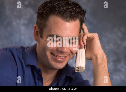 Man having a fun conversation on the phone Stock Photo