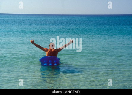 Floating on Air Mattress Stock Photo