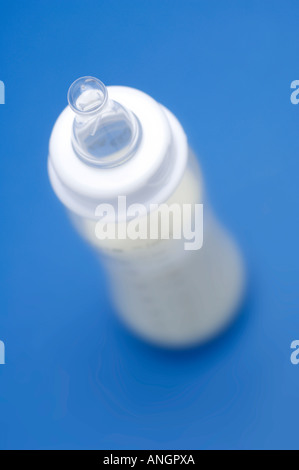 Baby's bottle filled with milk Stock Photo
