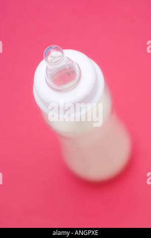 Baby's bottle filled with milk Stock Photo
