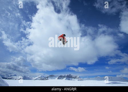 Young male snowboarder flying through the air in terrain park at Sunshine Village, Banff National Park, Alberta, Canada Stock Photo