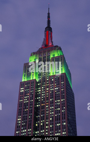 New York City Empire State Building with red and green Christmas Lights. National Historic Landmark. Art Deco architecture. Stock Photo