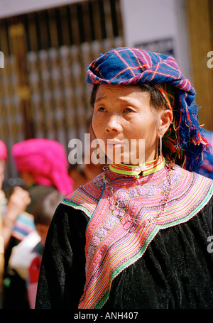 Portrait of a woman of the Hmong Tribe in traditional dress at the market in BacHa Northern Vietnam Stock Photo