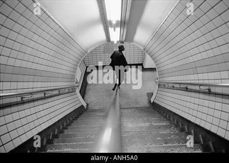 Walking down the stairs of the London Underground , London , UK Stock Photo
