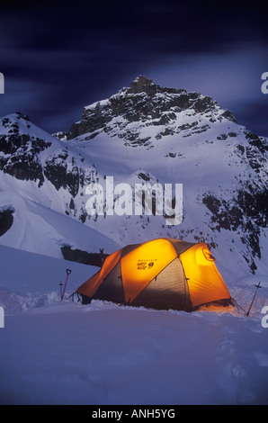 Backcountry skiers camp on moonlight night, Bugaboo Provincial Park, British Columbia, Canada. Stock Photo
