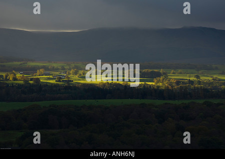 A stormy evening looking onto the Campsie Fells, Scotland. Farm in ...