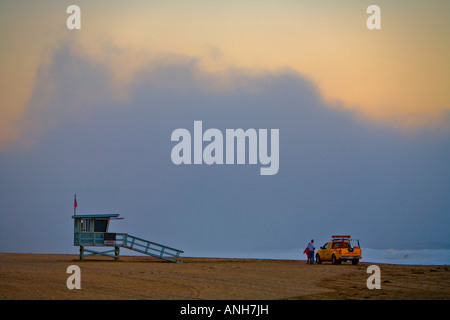 Lifeguard truck in front of lifeguard tower on a foggy afternoon on Westward Beach, Zuma Beach, Malibu, California Stock Photo