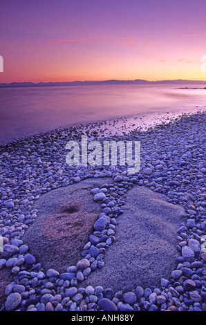 Roberts Creek pebble beach and the Strait of Georgia at sundown, Sunshine Coast, British Columbia, Canada. Stock Photo