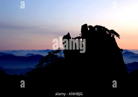 low hanging clouds in Chinas Huang Shan mountains Stock Photo