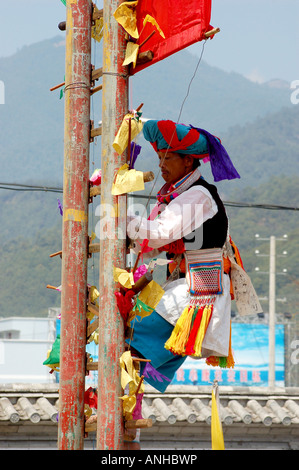 China Yunnan Baoshan lisu minority festival people climb knife Stock Photo