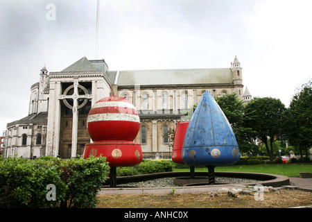 Bouys outside the University of Ulster at York st with Belfast Cathedral and its new spire in the background Stock Photo