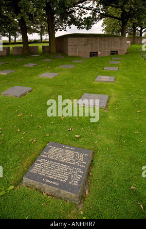 Graves and bunker at Langemark German military cemetery of WW1 soldiers near Ypres in Belgium Stock Photo